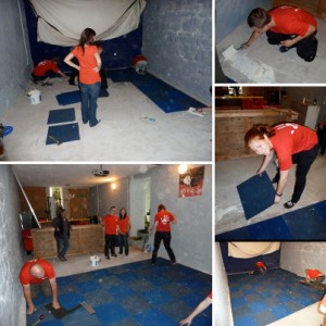 Volunteers laying new carpet tiles